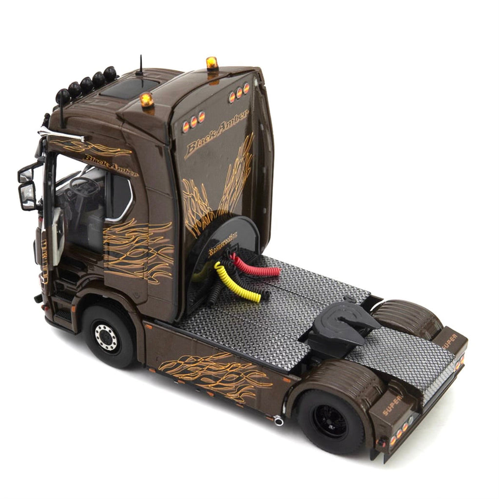 die cast model of a Scania  truck in black amber  livery made by IMC in 1/50 scale