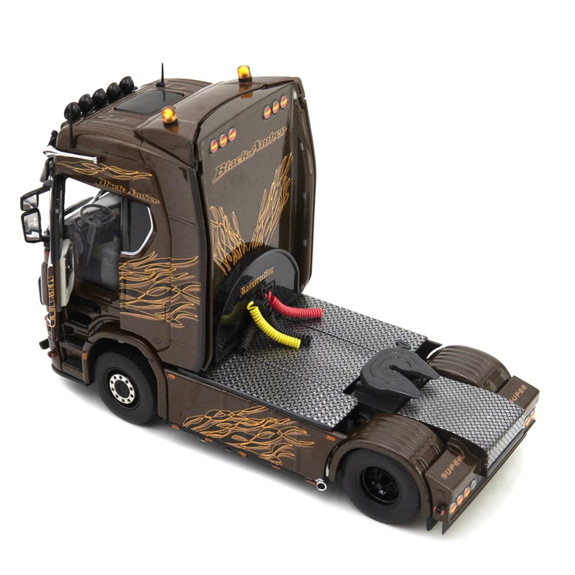 die cast model of a Scania  truck in black amber  livery made by IMC in 1/50 scale