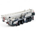 die cast model of a white crane Demag ac100/4 L  made by Conrad in 1/50 scale