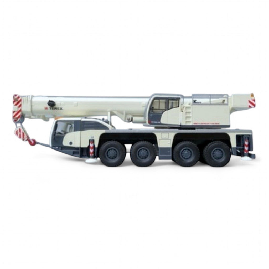 die cast model of a white crane Demag ac100/4 L  made by Conrad in 1/50 scale