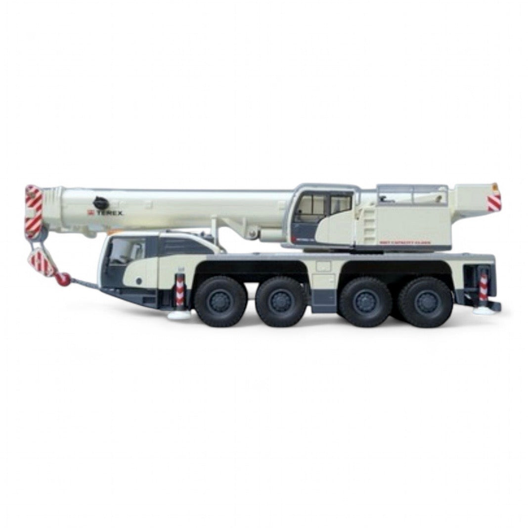 die cast model of a white crane Demag ac100/4 L  made by Conrad in 1/50 scale