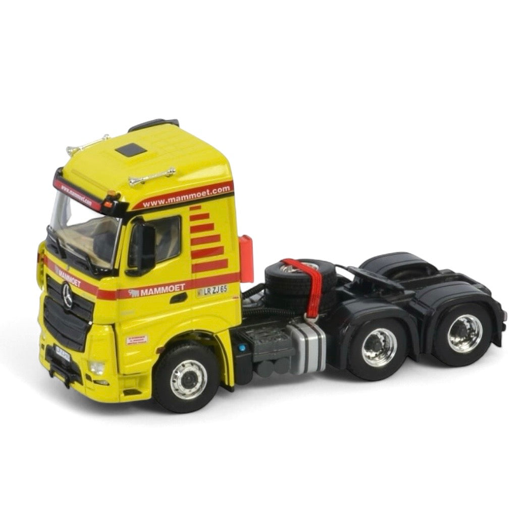 die cast model of a Mercedes Actros in Mammoet livery made by WSI in 1/50 scale