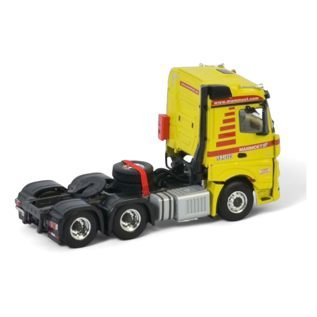 die cast model of a Mercedes Actros in Mammoet livery made by WSI in 1/50 scale
