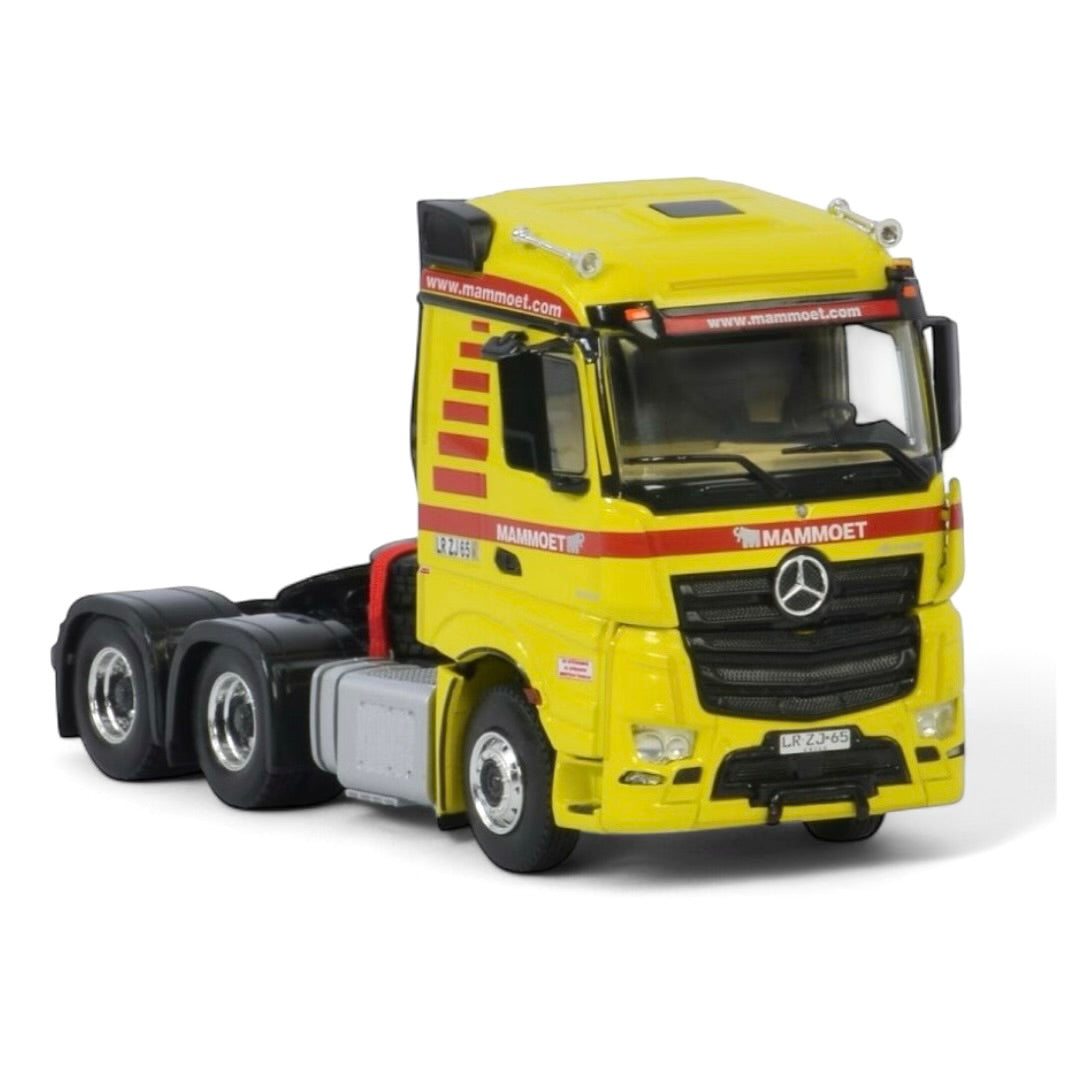 die cast model of a Mercedes Actros in Mammoet livery made by WSI in 1/50 scale