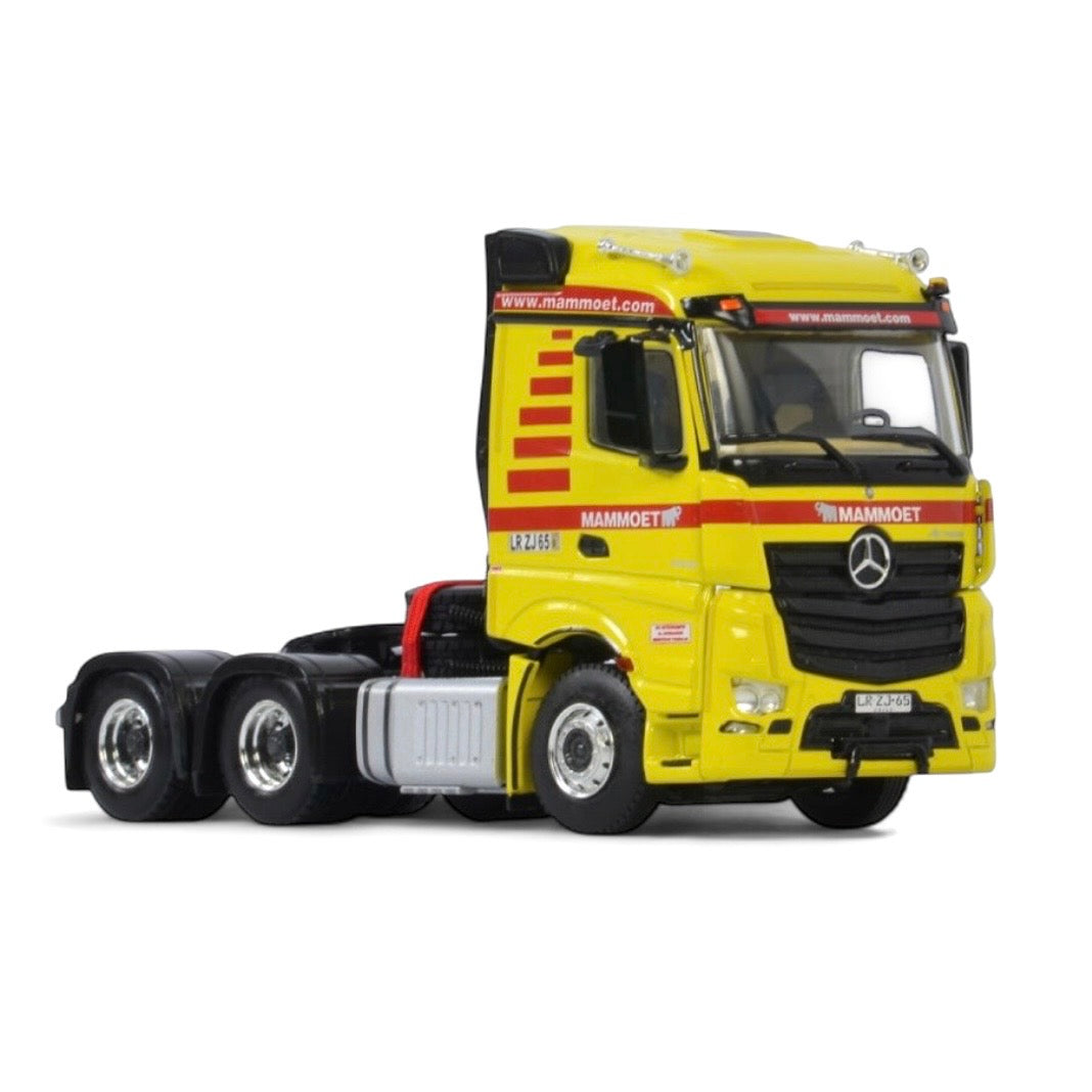 die cast model of a Mercedes Actros in Mammoet livery made by WSI in 1/50 scale