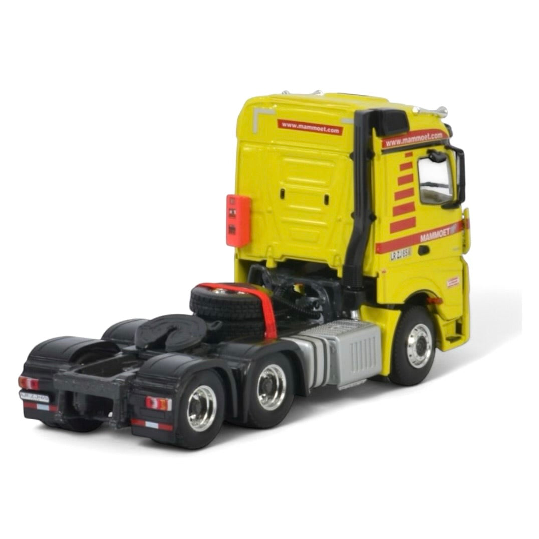 die cast model of a Mercedes Actros in Mammoet livery made by WSI in 1/50 scale