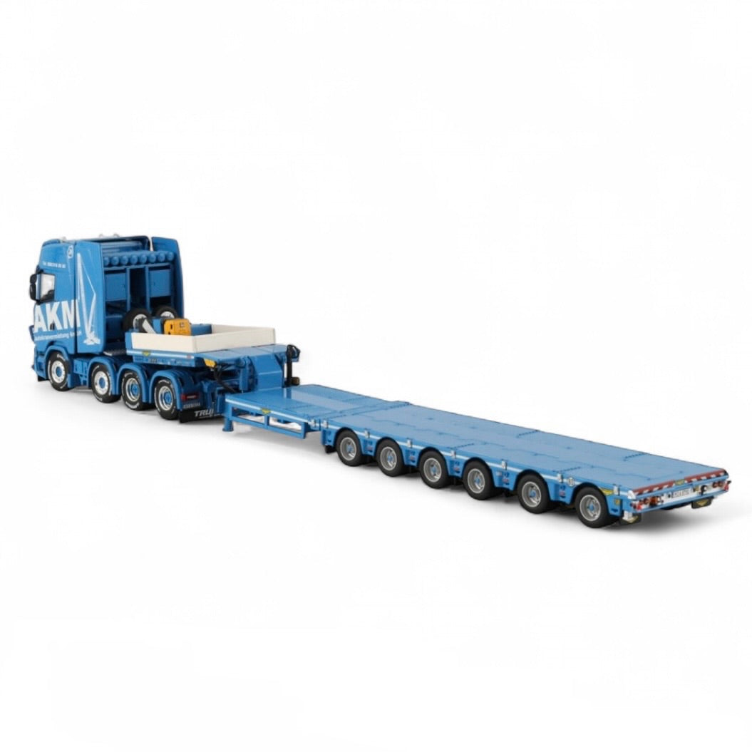 die cast model of a Scania lo loader truck in the livery of AKM made by WSI  in 1/50 scale