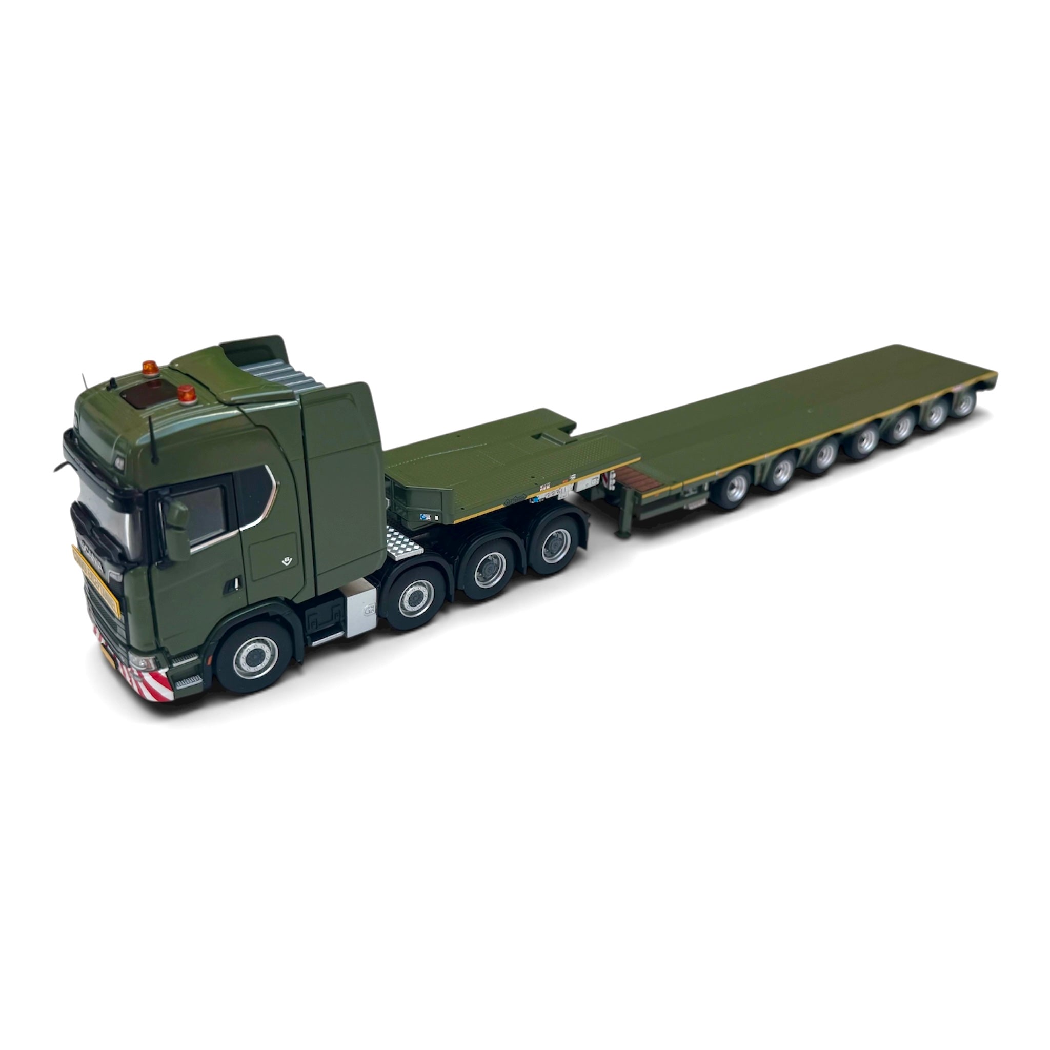 Model of a green truck with a flatbed trailer on a white background